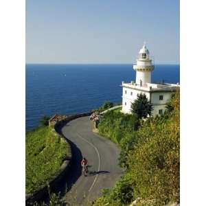  San Sebastian Bay Clifftop Lighthouse with Cyclist Riding 