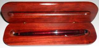   red ballpoint pen in wooden gift box author binding office product