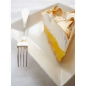  Single Slice of Delicious Lemon Meringue Pie with Fork 