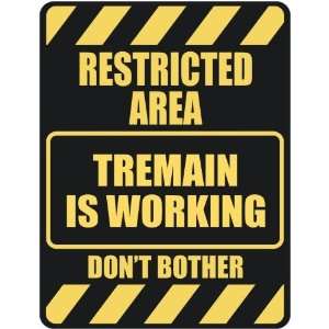   RESTRICTED AREA TREMAIN IS WORKING  PARKING SIGN