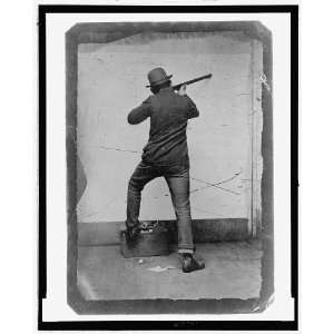   man posed as if shooting a rifle,1870 1900,Tintype