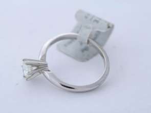 This ring is 14k white gold and it weighs 2.7 grams. It is a size 6 1 