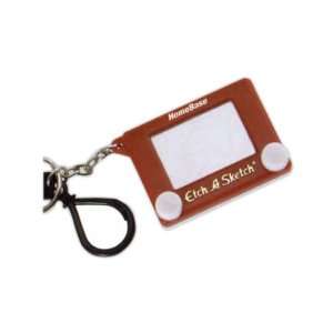    Key holder with miniature Etch a sketch game.