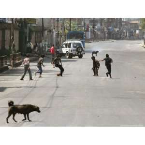  Children Play Soccer on a Deserted Street of Katmandu 