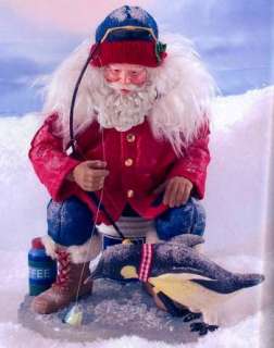 The little Penguin with ear muffs is adorable as he fishes with Santa.
