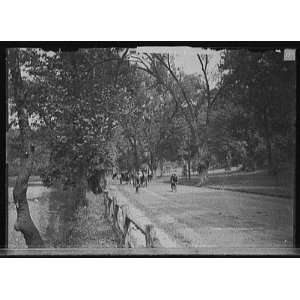  Cyclists on road by river