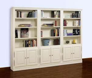 White living room shelving filled with books and other accent pieces