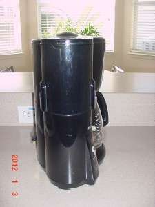   filter basket, will grind coffee beans or use regular coffee. Comes