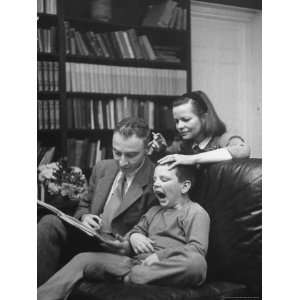 Robert Oppenheimer Reading a Book to His Son Peter and Wife 
