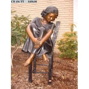    Bronze Statue of Girl Sitting in a Chair